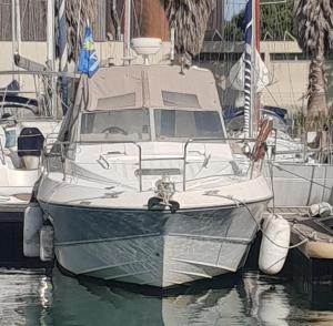 a boat is docked at a dock in the water at Sea Guesthouse in Canet-en-Roussillon