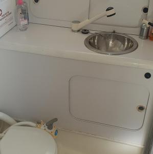 a bathroom with a sink and a toilet in an airplane at Sea Guesthouse in Canet-en-Roussillon