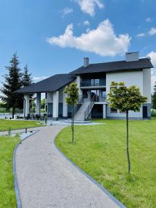 a house with a walkway in front of it at Willa Czajki in Oświęcim