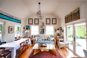 a living room with a table and a dining room at Lynster House in Monaghan