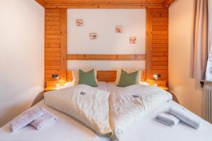 Postel nebo postele na pokoji v ubytování Panoramahotel Stocker