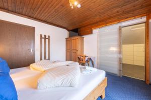 Postel nebo postele na pokoji v ubytování Panoramahotel Stocker