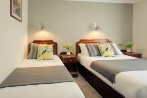 Letto o letti in una camera di Hillgrove Guesthouse