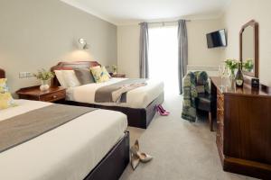 Letto o letti in una camera di Hillgrove Guesthouse