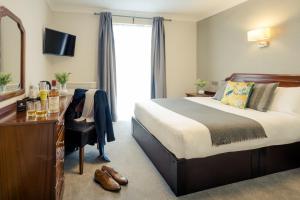 Letto o letti in una camera di Hillgrove Guesthouse