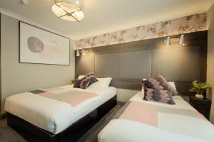 Letto o letti in una camera di Hillgrove Guesthouse