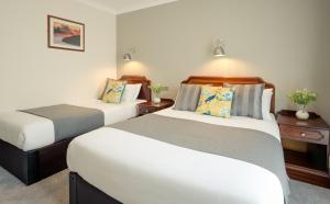 Letto o letti in una camera di Hillgrove Guesthouse