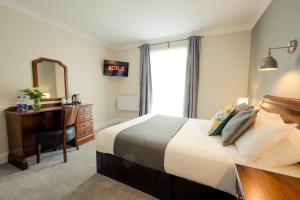 Letto o letti in una camera di Hillgrove Guesthouse
