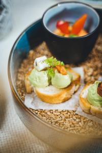 a bowl of food with bread and a bowl of soup at Hotel Sportalm in Bad Kleinkirchheim