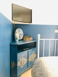 Μια τηλεόραση ή/και κέντρο ψυχαγωγίας στο Casa Caterina Lake View Holidays Apartments