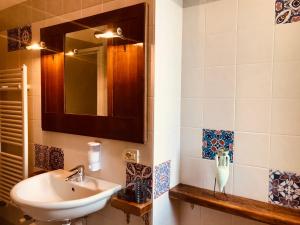 a bathroom with a sink and a mirror at Casa Caterina Lake View Holidays Apartments in Peschiera del Garda +33 photos