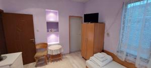 a small room with a small table and a chair at Guest House Kukera in Pavel Banya +12 photos