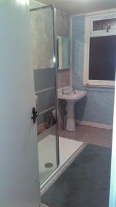 a bathroom with a shower and a sink at Braeside Craighouse Jura in Craighouse