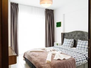 Postelja oz. postelje v sobi nastanitve Cozy Special Pallady Apartament with Garden & Courtyard