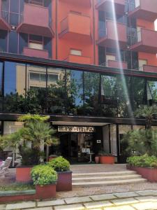 a building with plants in front of it at Hotel Prestigio in Cesenatico