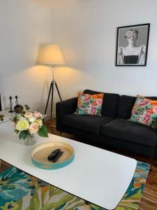 a living room with a couch and a coffee table at Causewayside in Edinburgh