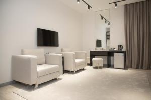 TV a/nebo společenská místnost v ubytování Maison