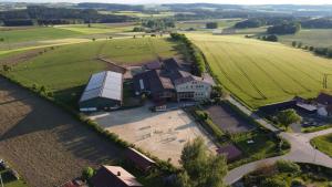 an aerial view of a house in the middle of a field at Pension & Reitschule Fuchsenhof in Seebarn