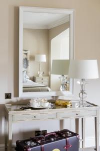 a bathroom with a mirror and a sink at The Bath Priory - A Relais & Chateaux Hotel in Bath