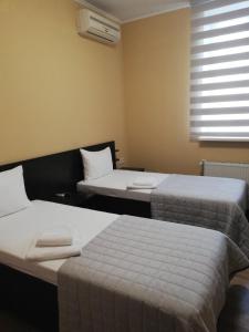Postel nebo postele na pokoji v ubytování Prometey Hotel