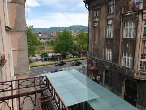 a view of a street from a balcony of a building at Studio Matejki C in Bielsko-Biala