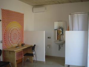 a room with a table and a sink in it at Villa Romaní SUITE in Son Carrio