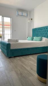 Łóżko lub łóżka w pokoju w obiekcie Hotel Boutique Andalucia