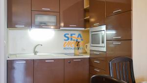 A kitchen or kitchenette at Sea View Rental Front Beach