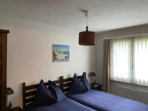 מיטה או מיטות בחדר ב-Superior Apartment 100m2 Bodmisonne - Grindelwald