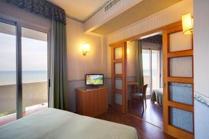 Кровать или кровати в номере Hotel Palace