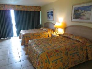 Ένα ή περισσότερα κρεβάτια σε δωμάτιο στο Signature Condos South Padre Island +24 φωτογραφίες