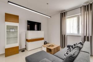 Televízia a/alebo spoločenská miestnosť v ubytovaní Zielone Apartamenty Katowice Chorzów