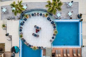 an overhead view of a swimming pool with a circle ofools at Pinea Hotel Resort & Spa in Golem