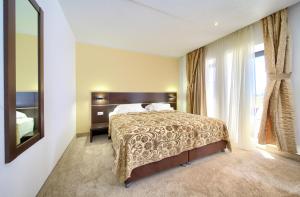 Posteľ alebo postele v izbe v ubytovaní Hotel Marina