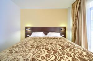 Posteľ alebo postele v izbe v ubytovaní Hotel Marina