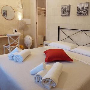 מיטה או מיטות בחדר ב-Dimora Assuntina Martano