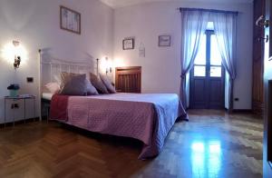 Posteľ alebo postele v izbe v ubytovaní Casa Brunella