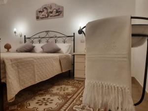 Postel nebo postele na pokoji v ubytování Casa Vacanze Lu Cumentu