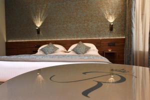 Postel nebo postele na pokoji v ubytování Rosa Salva Hotel