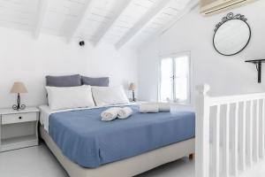 Кровать или кровати в номере Milia Beach Apartments
