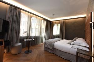 Postel nebo postele na pokoji v ubytování Rosa Salva Hotel