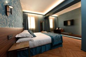 Postel nebo postele na pokoji v ubytování Rosa Salva Hotel