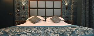 Postel nebo postele na pokoji v ubytování Rosa Salva Hotel