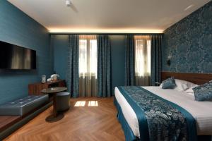 Postel nebo postele na pokoji v ubytování Rosa Salva Hotel