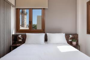 Postel nebo postele na pokoji v ubytování Al Daliani Minaret Rooms