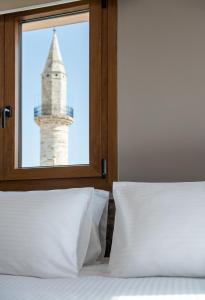 Postel nebo postele na pokoji v ubytování Al Daliani Minaret Rooms