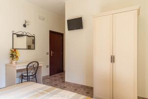 Postel nebo postele na pokoji v ubytování B&B La Mortella