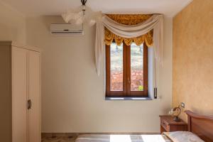 Postel nebo postele na pokoji v ubytování B&B La Mortella