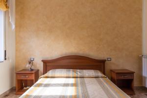 Postel nebo postele na pokoji v ubytování B&B La Mortella