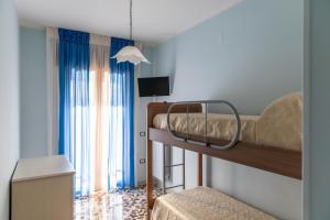 Postel nebo postele na pokoji v ubytování B&B La Mortella